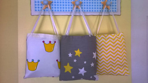 3 Fitted Crib Sheet with Ties hanging in cotton bags - white, gray and yellow