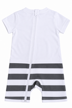 White baby romper with a front zipper and horizontal dark gray and white stripes on the lower half, shown flat on a white background.