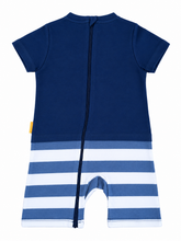 A short-sleeve baby romper shown from the back, featuring a solid navy blue upper section and horizontal blue and white stripes on the lower section, with a central zipper.