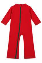 A bright red baby one-piece jumpsuit with long sleeves and legs, featuring a green zipper running down the front and green piping details on the cuffs and hem.