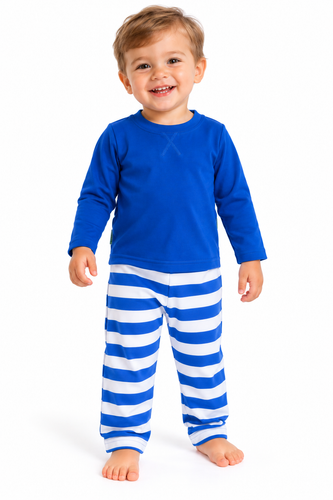A smiling toddler standing against a white studio background, wearing a bright blue long-sleeve top and matching blue-and-white horizontally striped pants.