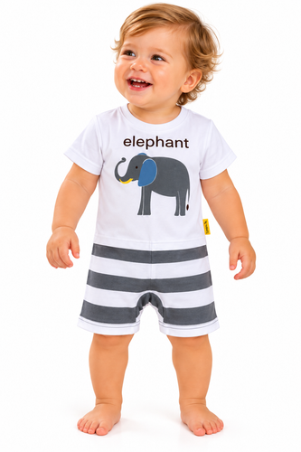 A smiling toddler standing against a white studio background, wearing a white short-sleeve romper with a printed elephant graphic and the word 'elephant' on the chest, plus dark gray and white horizontal stripes on the shorts.