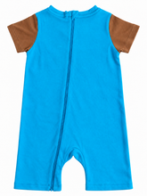 A baby short-sleeve romper in bright blue with contrasting brown sleeve panels, featuring a front zipper closure, shown against a plain white background.