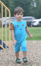 toddler boy in blue and brown romper with a bear head on front 