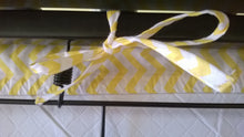 Fitted Crib Sheet with Ties- shows bottom of the crib ties in white with yellow chevron strips